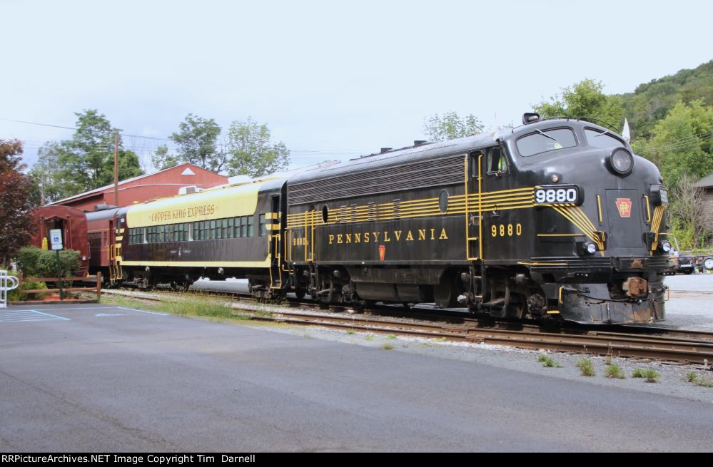 PRR 9880 puts the train away.